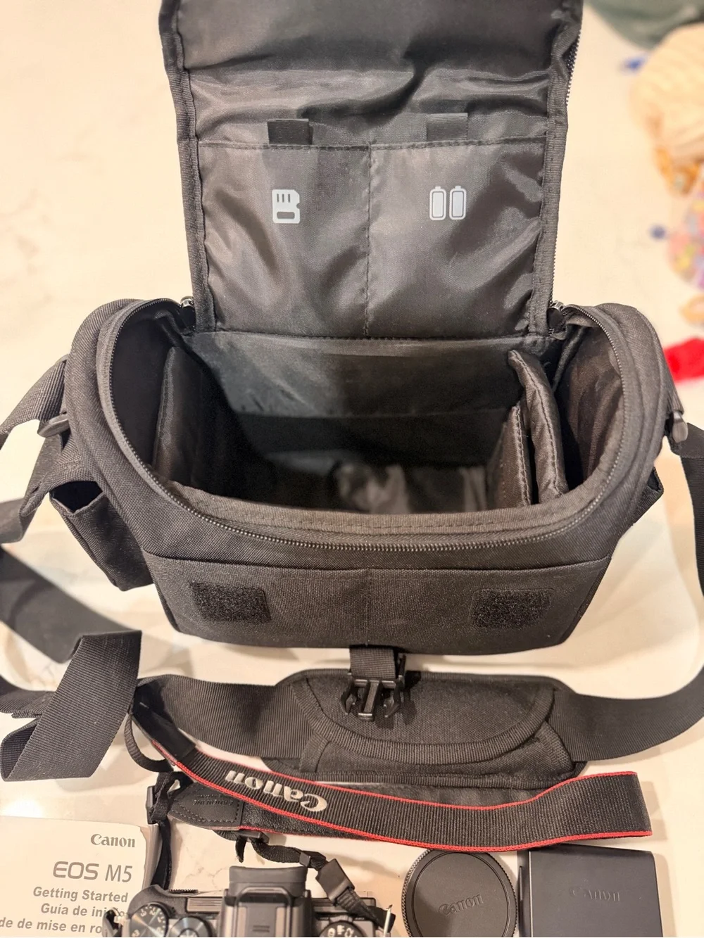 Canon Black Mirrorless Camera with Black Lens and Accessories